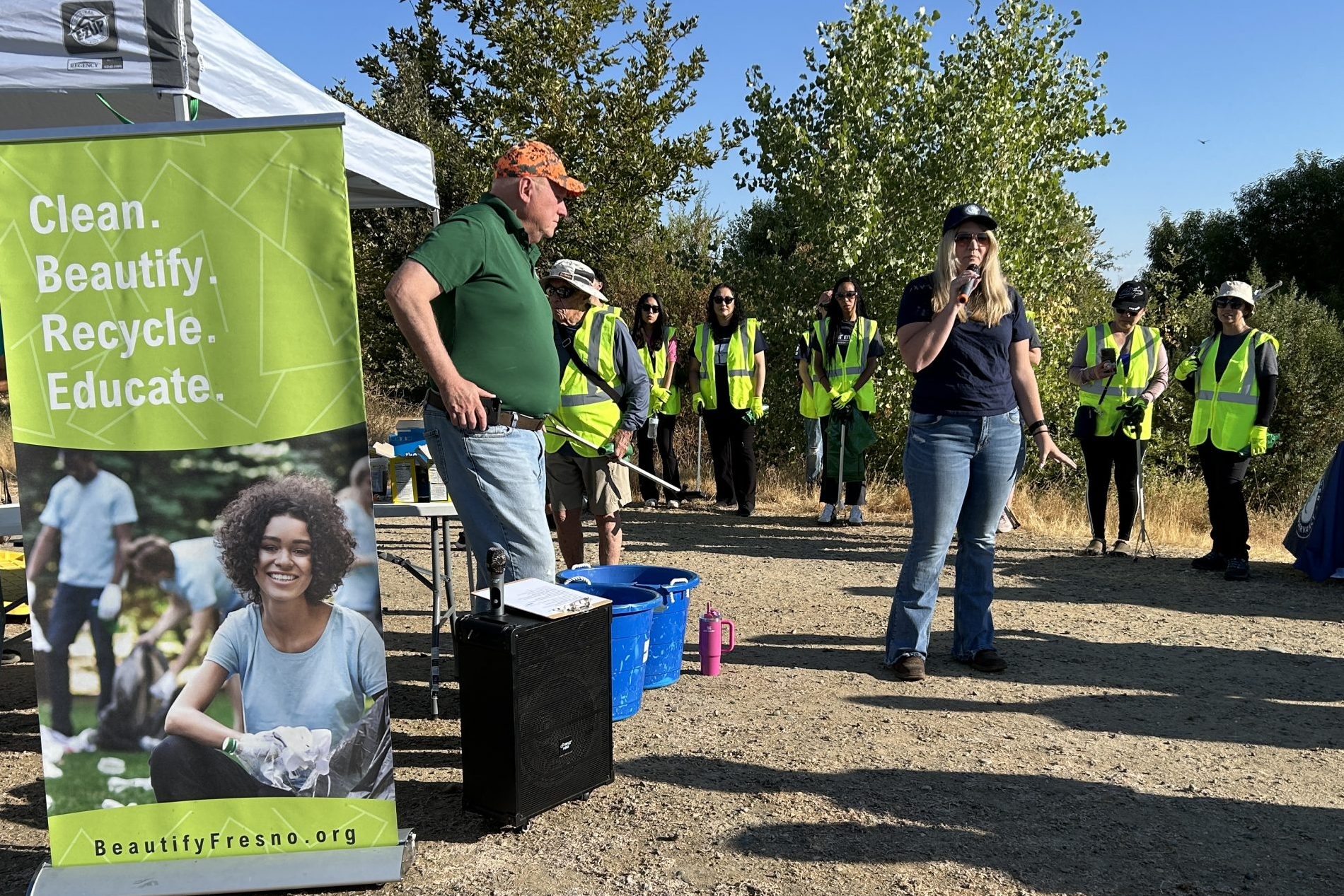 Executive Officer Kari Daniska addressing a group of volunteers.